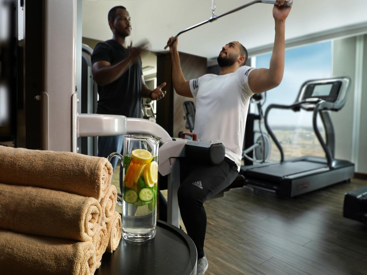 Millennium Madinah Airport Hotel Medina Exterior photo A personal trainer with a client